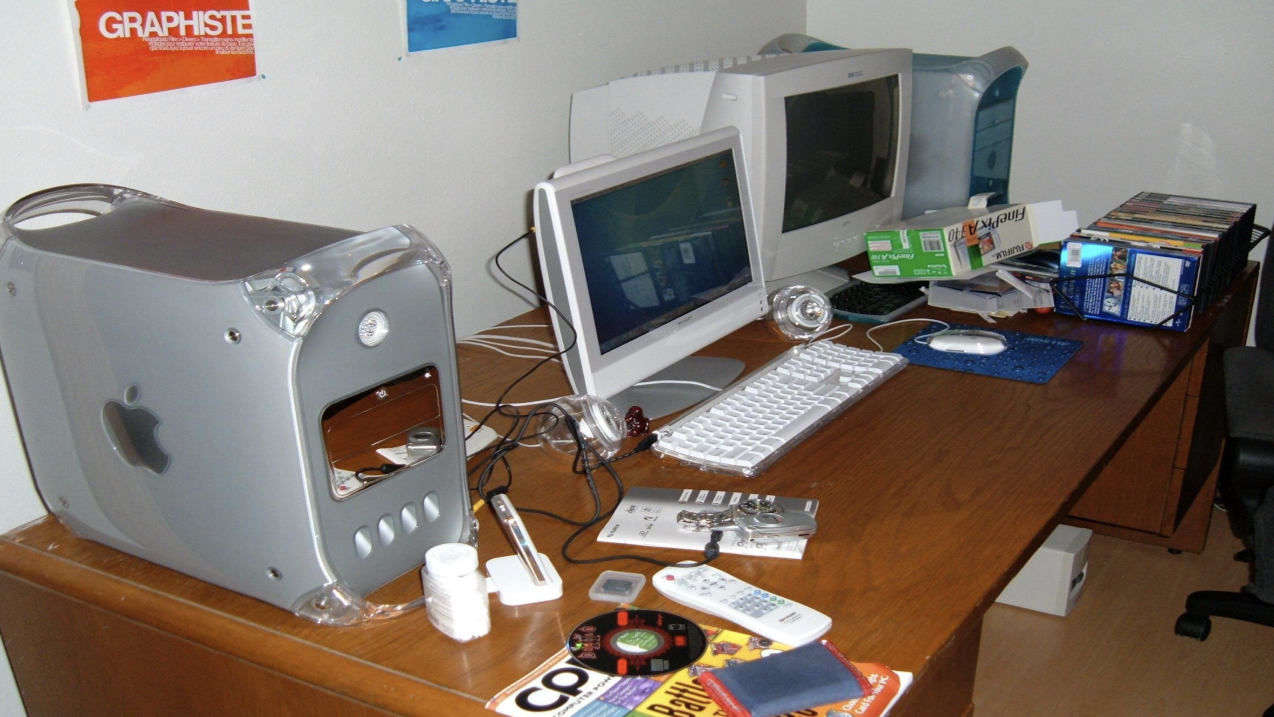 gaming 2000s mac computer setup messy desk cds cables nostalgic home pc