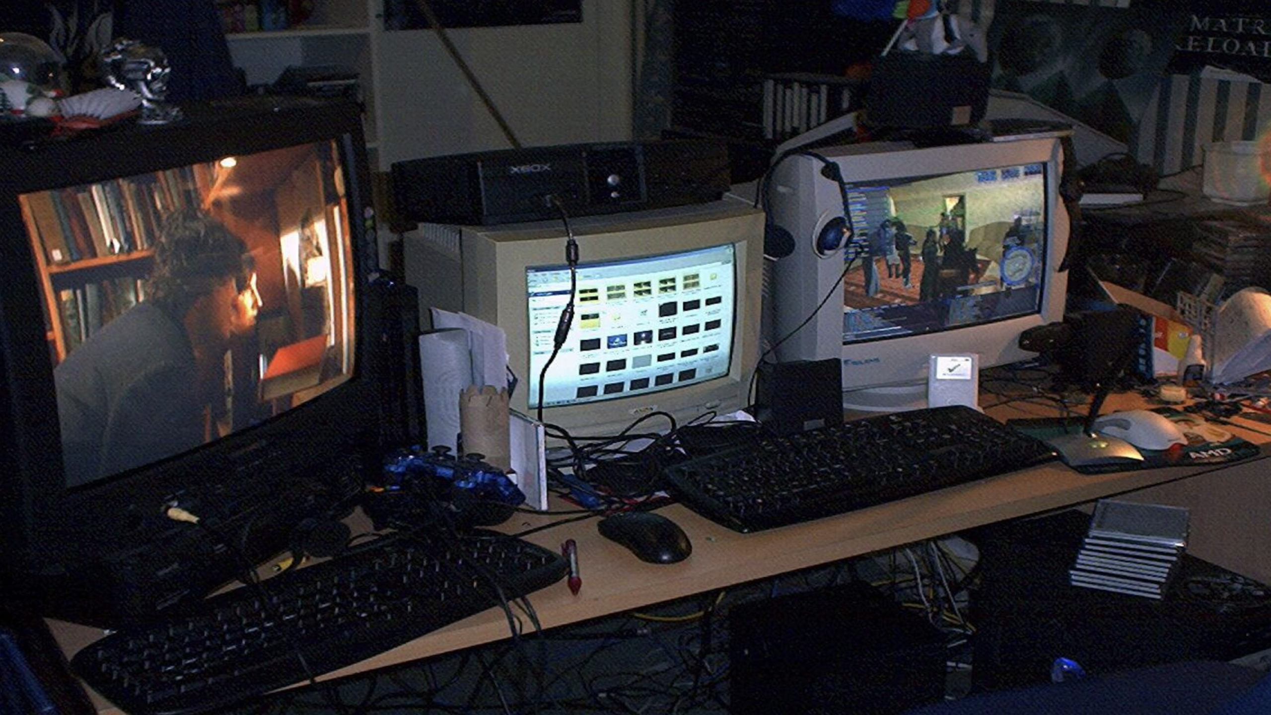 dual CRT monitor setup messy desk cables headphones early 2000s bedroom
