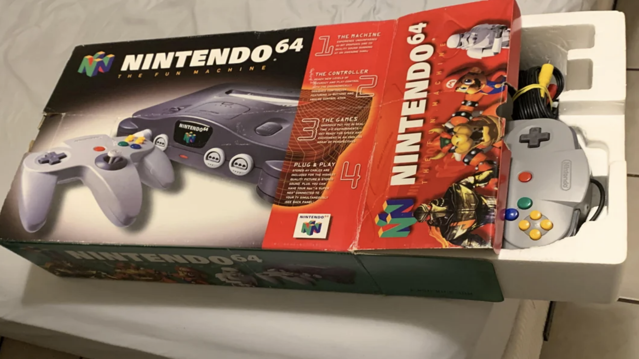 Old gaming consoles Nintendo 64 with original box collector value nostalgic setup