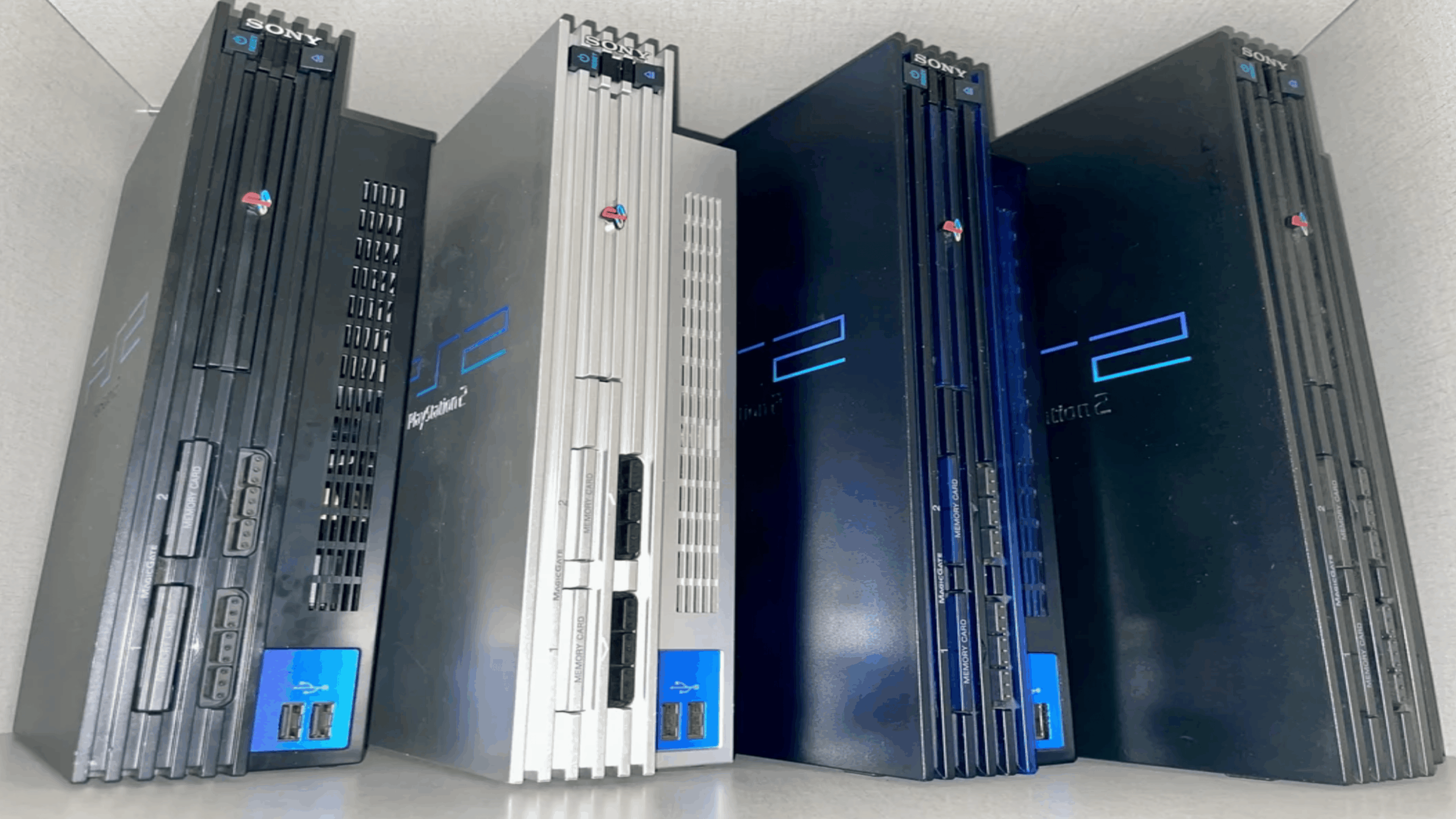 Old gaming consoles PlayStation 2 fat model with accessories and controllers bundle