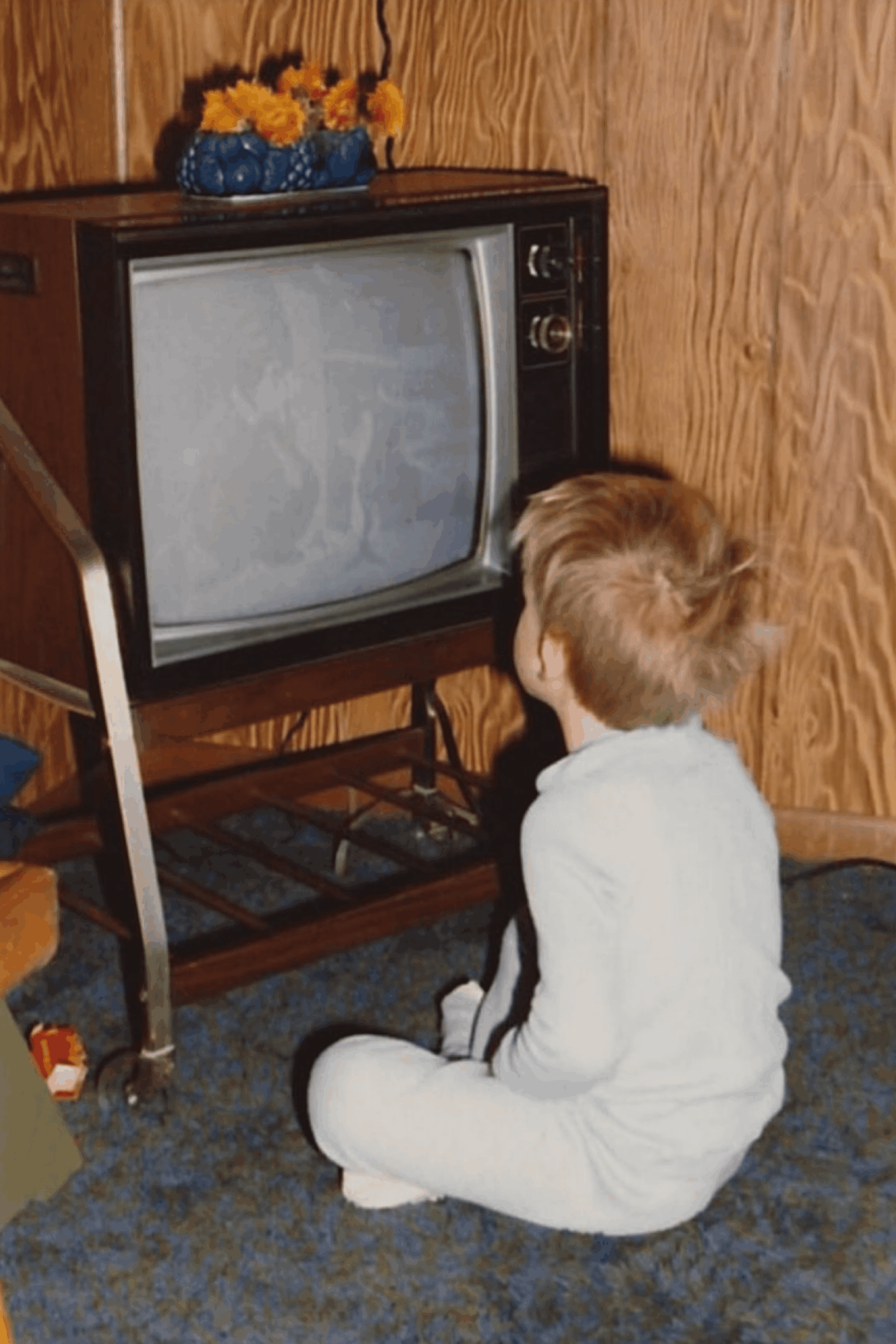 kid playing old games close to crt tv nostalgic moment