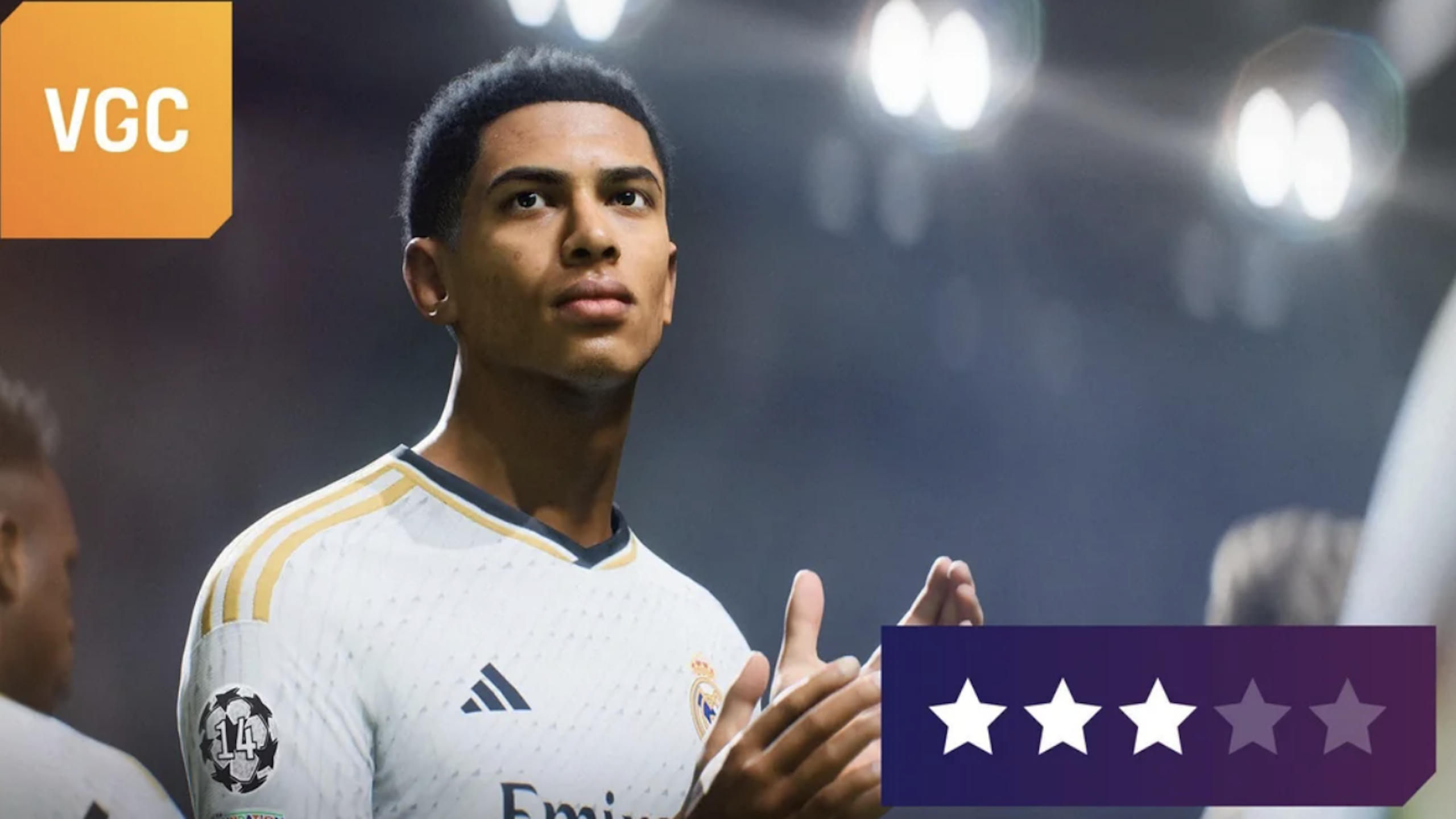 A soccer player in a white Real Madrid jersey looks upward under bright stadium lights, embodying the spirit of Physical Games. A VGC logo is in the top left, and a three-star rating out of five appears at the bottom right.