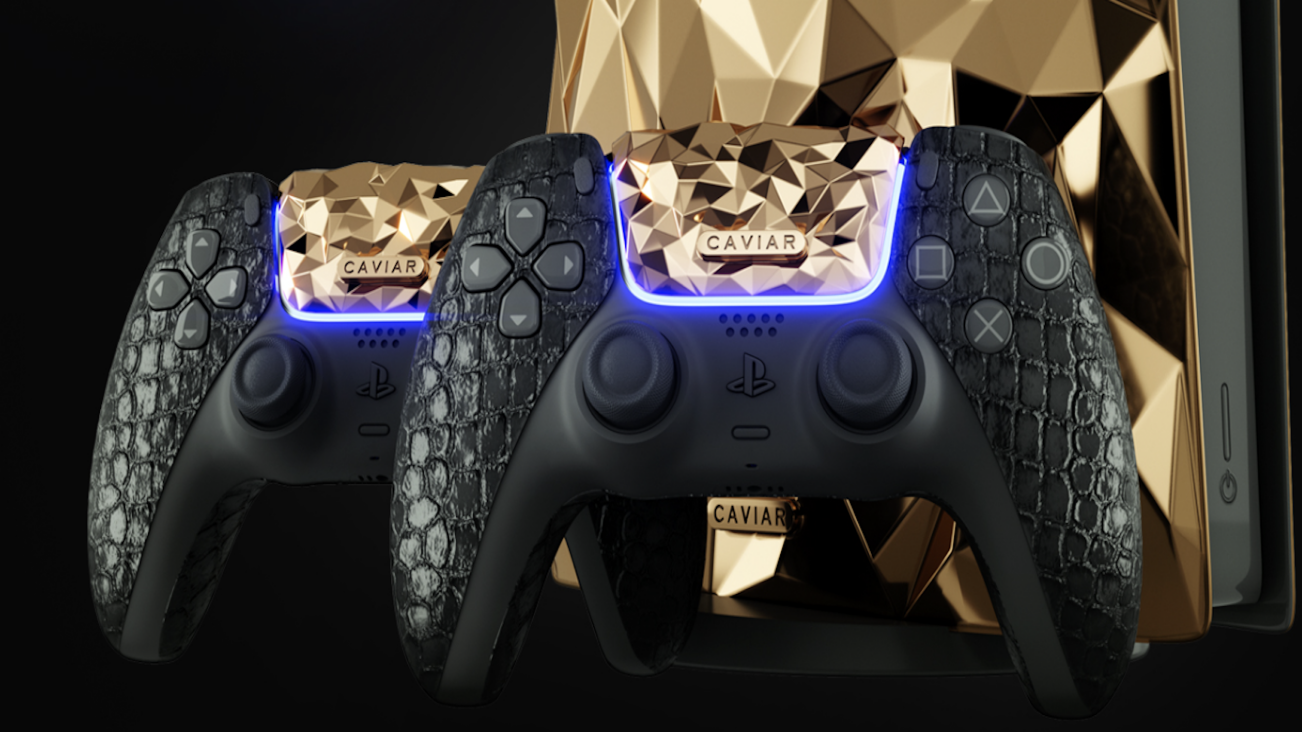 Two PlayStation controllers with black textured grips and gold geometric panels, featuring the word "Caviar," are shown in front of a matching gold, faceted object—likely a PlayStation console—capturing the ultimate in expensive gaming luxury.