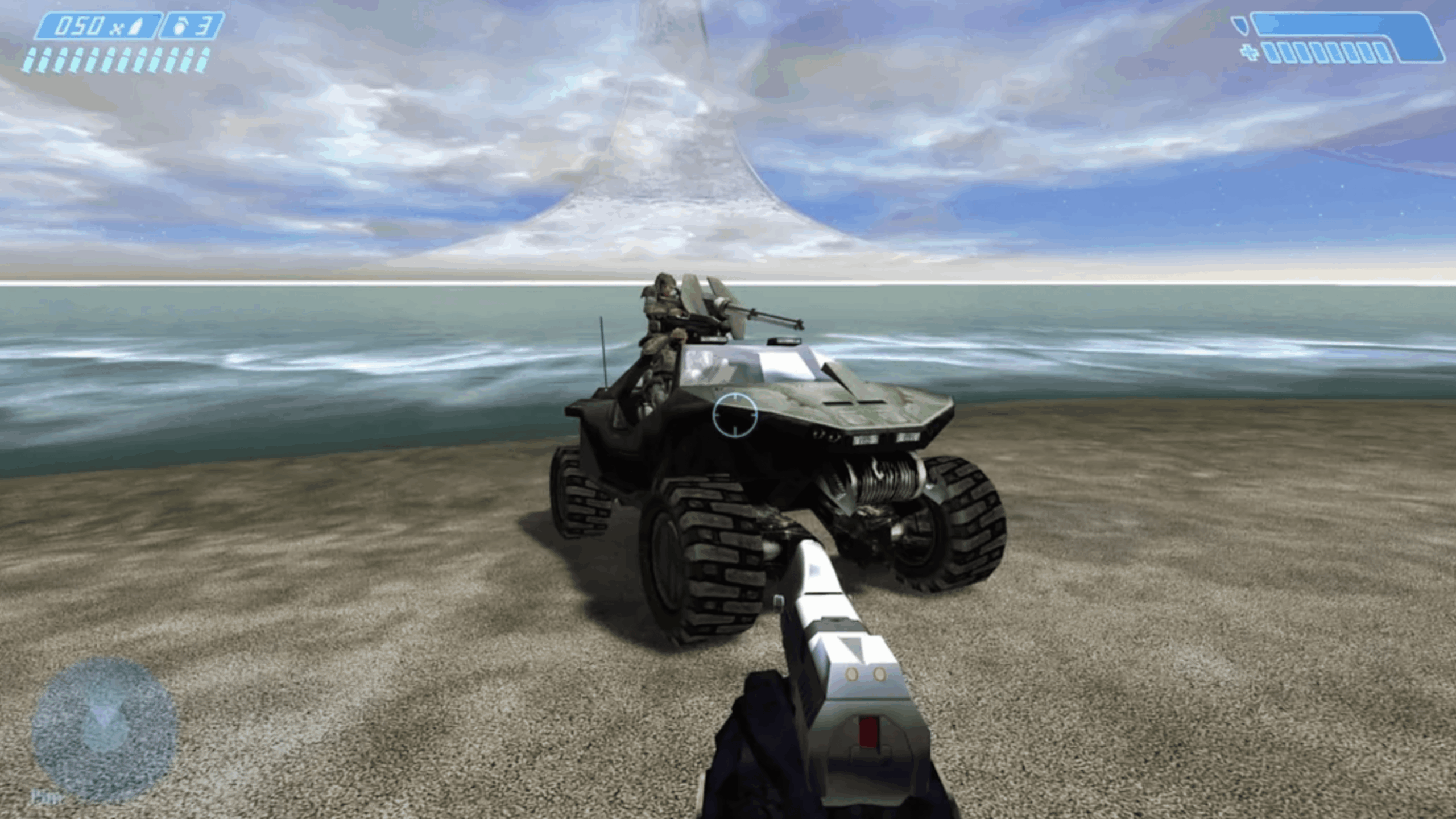 First-person view from a sci-fi video game, with Video Game Secrets hidden in plain sight—a pistol aimed at an armored jeep with a mounted gun on a sandy beach, water glistening nearby, and a mysterious ring structure looming in the sky.
