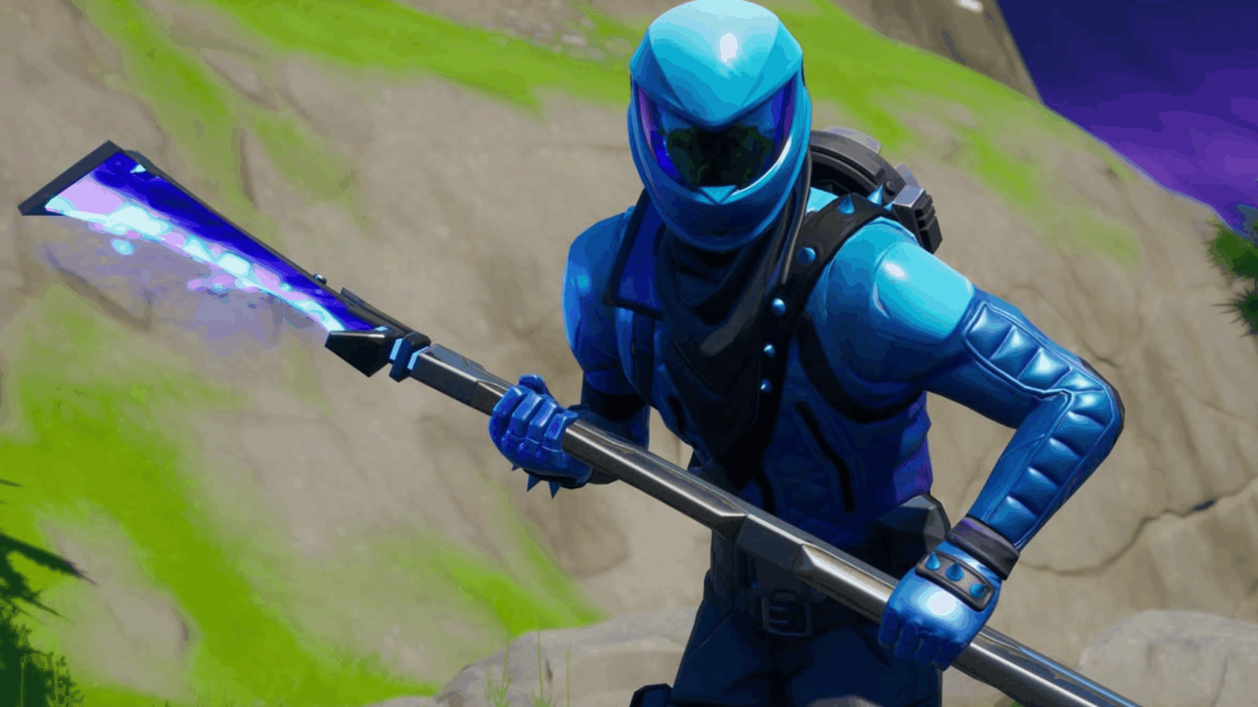 A character in a blue armored suit and helmet holds a glowing blue pickaxe in a rocky outdoor setting, inspired by the popular Fortnite Skins from the Fortnite video game.
