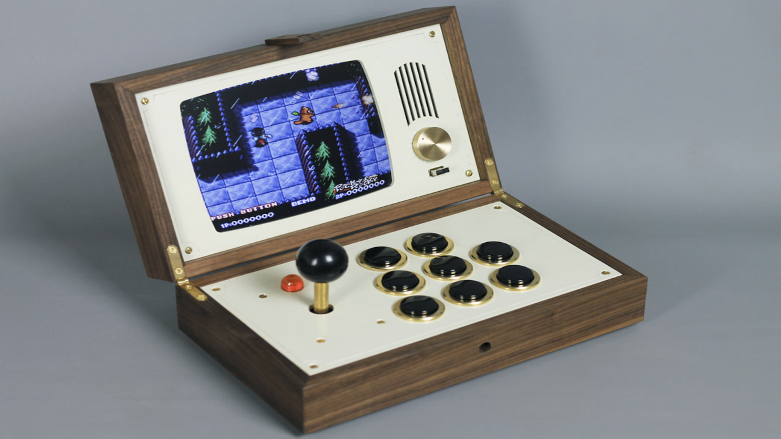 A retro arcade console with a joystick, buttons, and a screen displaying a pixelated video game. The console has a vintage wood and cream design with a speaker and dial, offering an expensive gaming experience for true enthusiasts.
