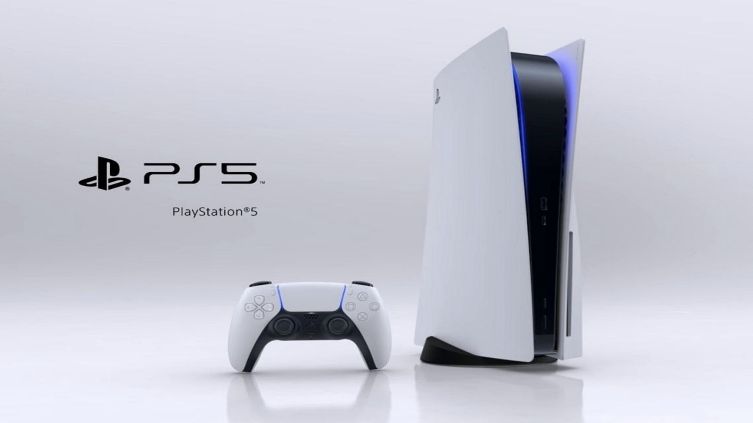 A PlayStation 5 console stands upright next to a white and black wireless controller on a light background. The PS5 and PlayStation 5 logos are visible to the left of the console.