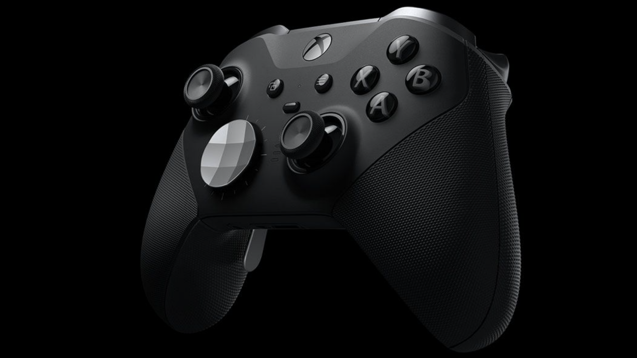 A black Xbox wireless game controller with textured grips, analog sticks, buttons, and directional pad—perfect for expensive gaming—shown against a black background.